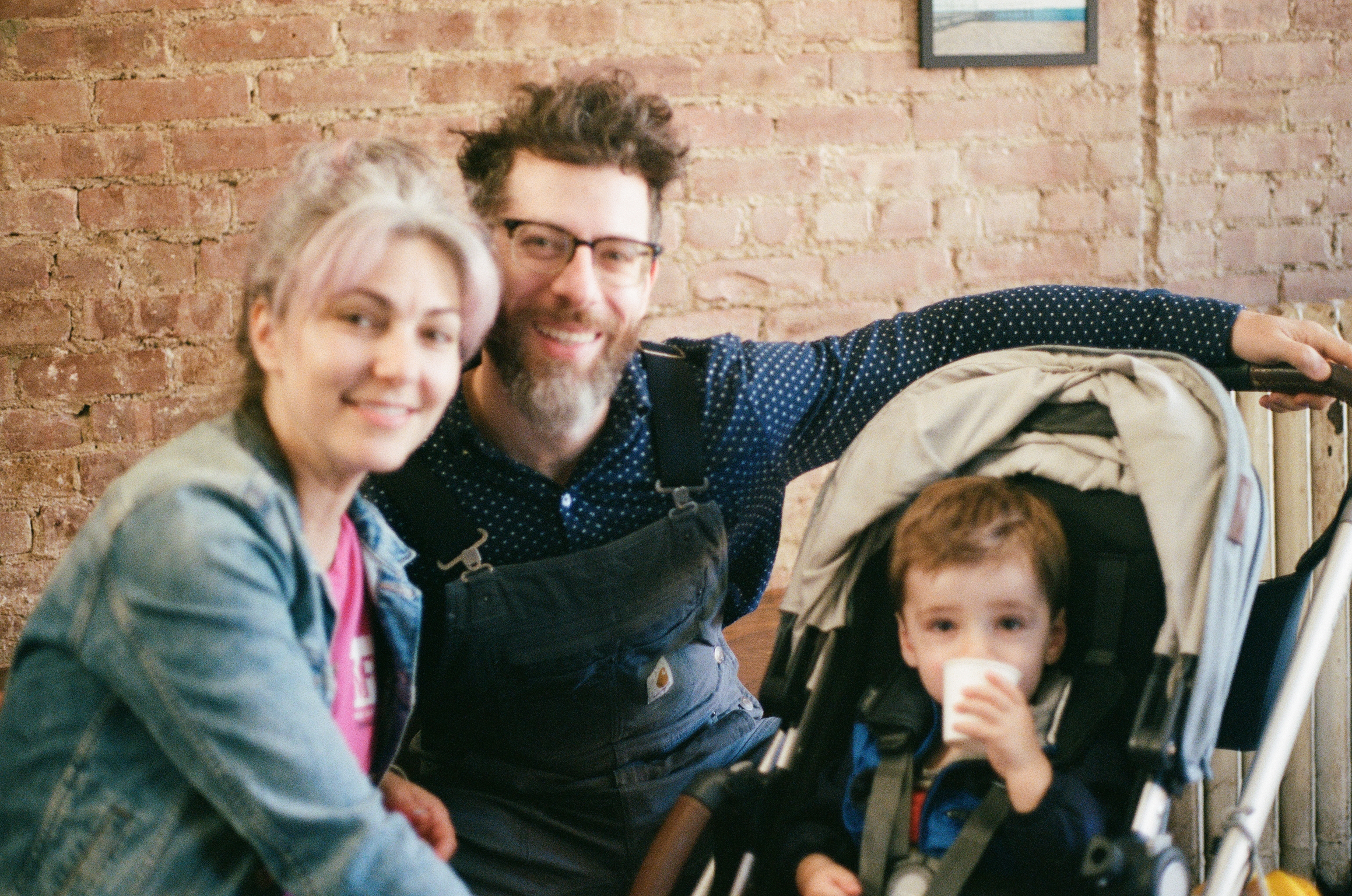 Emily, Sam, and baby Clark with his baby drink.